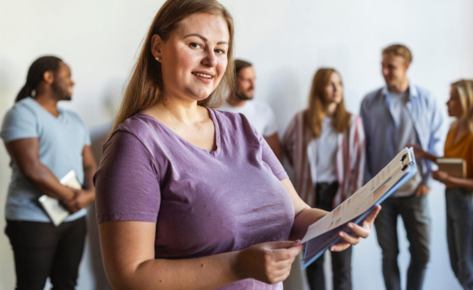 Person reviewing financial documents and charts, representing money mindset analysis